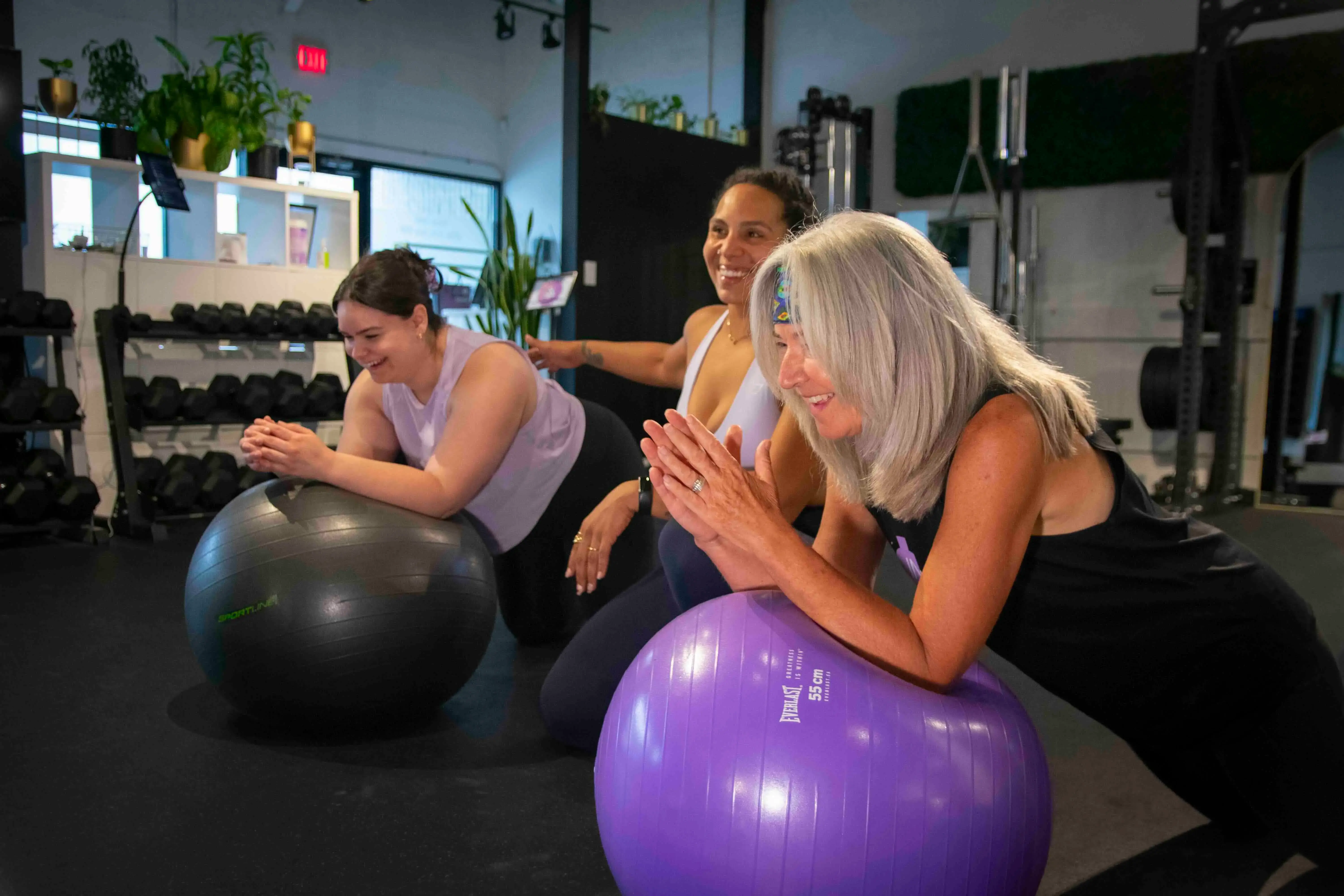 Large group of people working out in a boutique fitness class in Calgary
